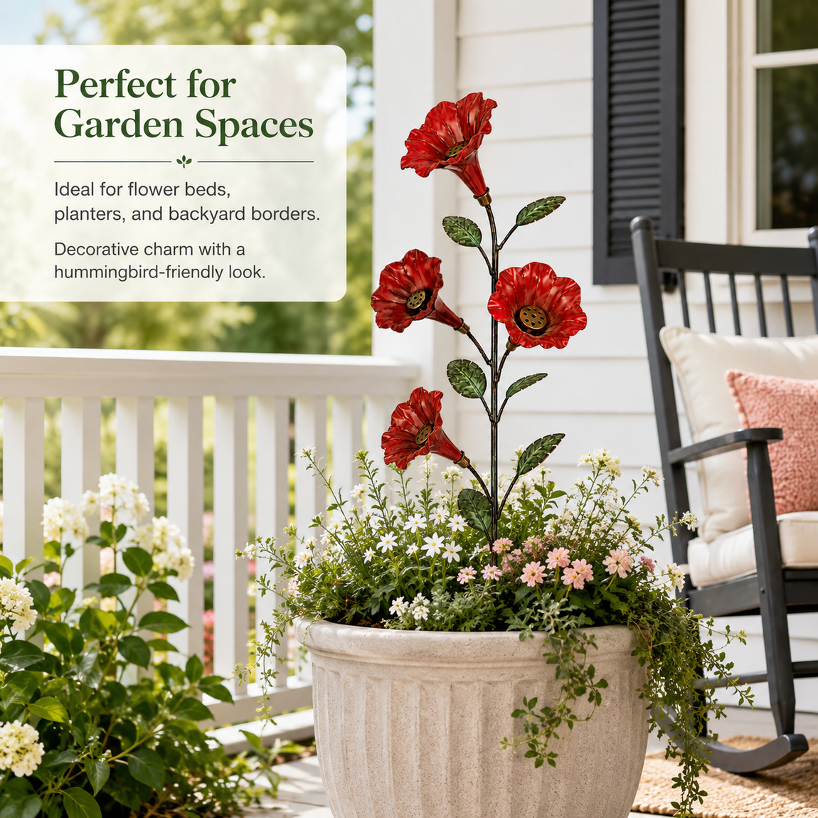 Red flower hummingbird feeder garden stake in a large porch planter