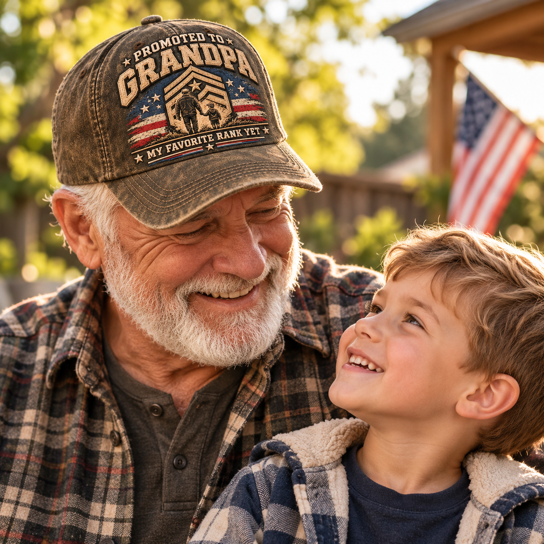 Grandfather wearing Promoted to Grandpa cap with his smiling grandson