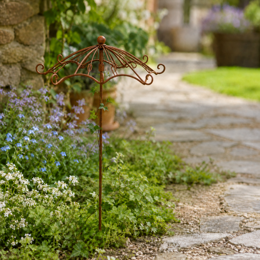 Vintage umbrella trellis along garden path