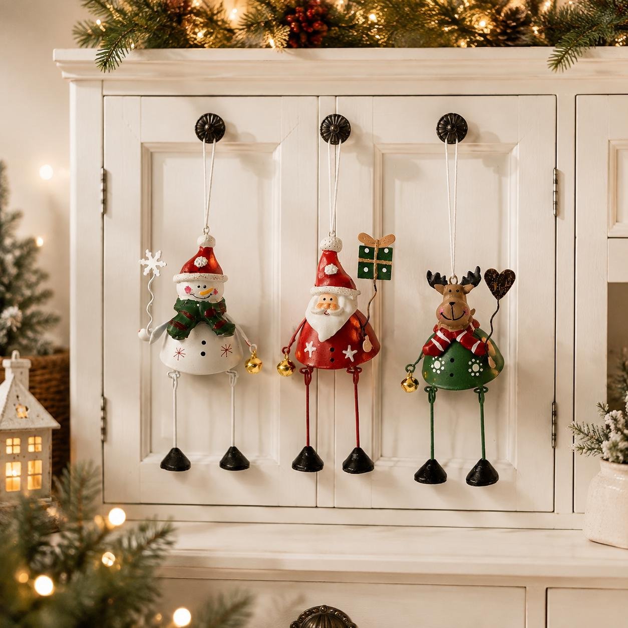 Metal Christmas ornaments hanging from cabinet handles