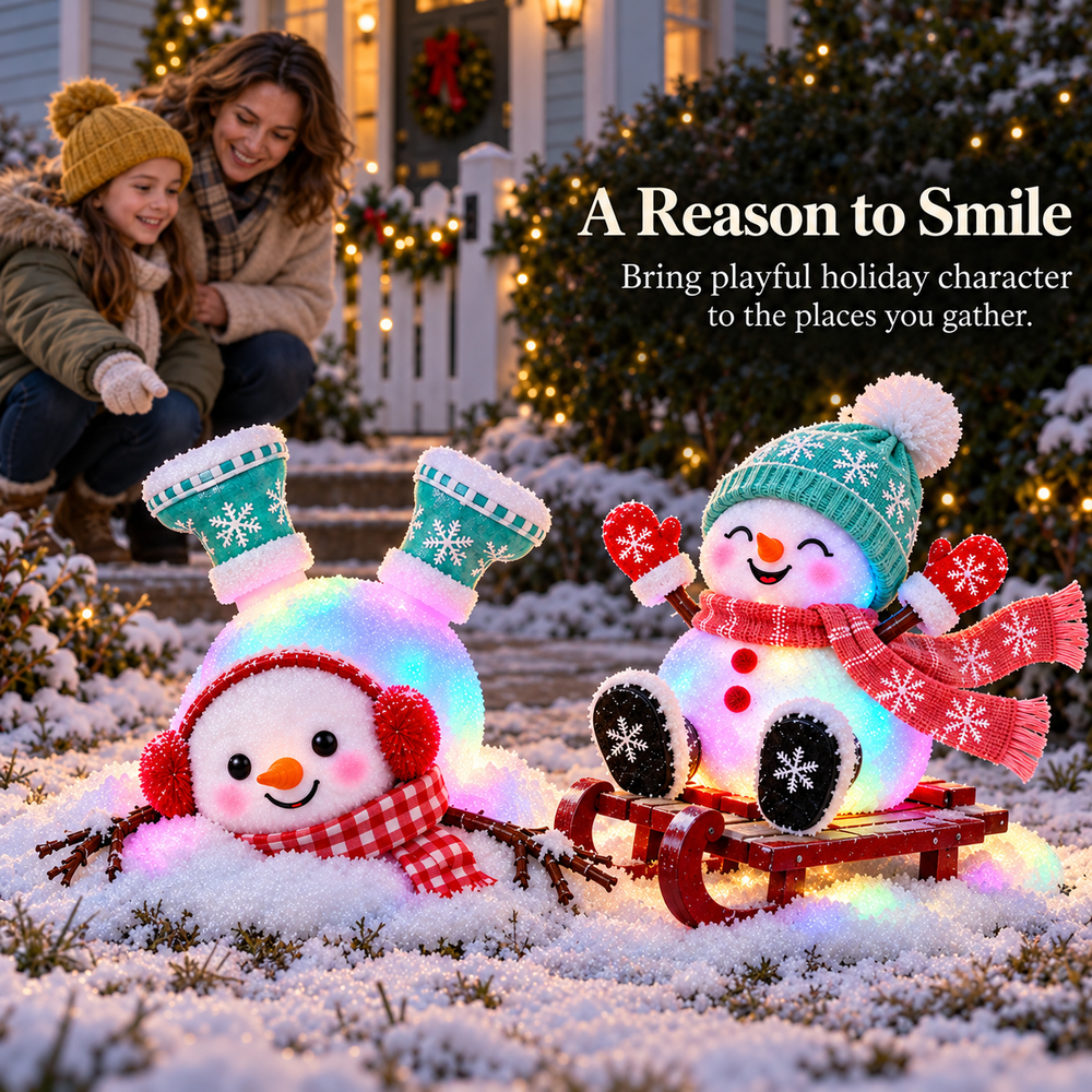 Mother and daughter smiling at two glowing snowman decorations on their snowy Christmas front path