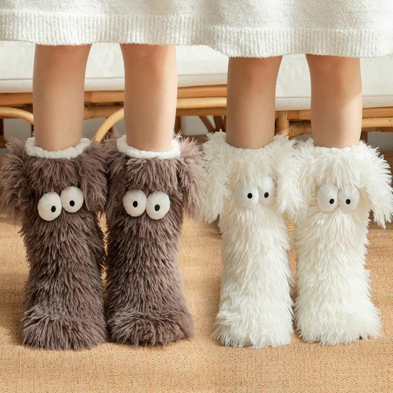 Different colors of fluffy monster slipper socks shown together