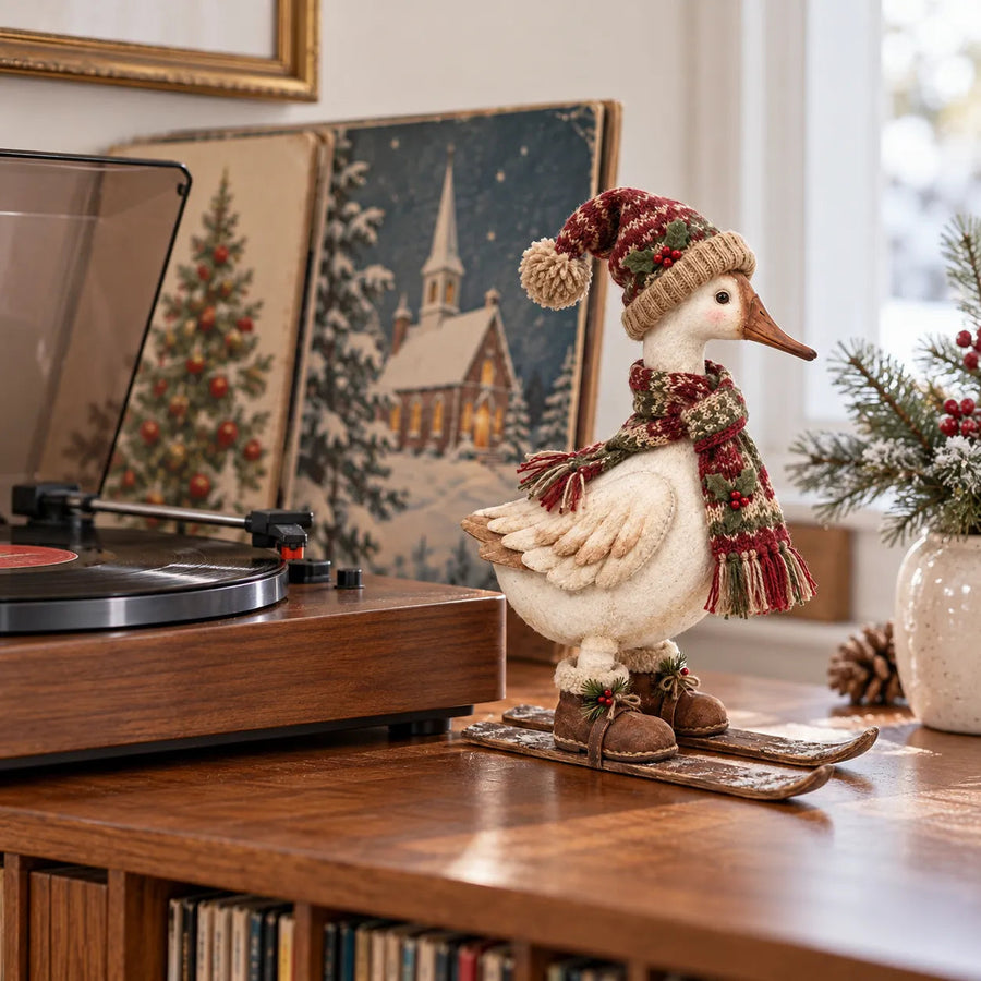 Christmas skiing goose beside winter artwork