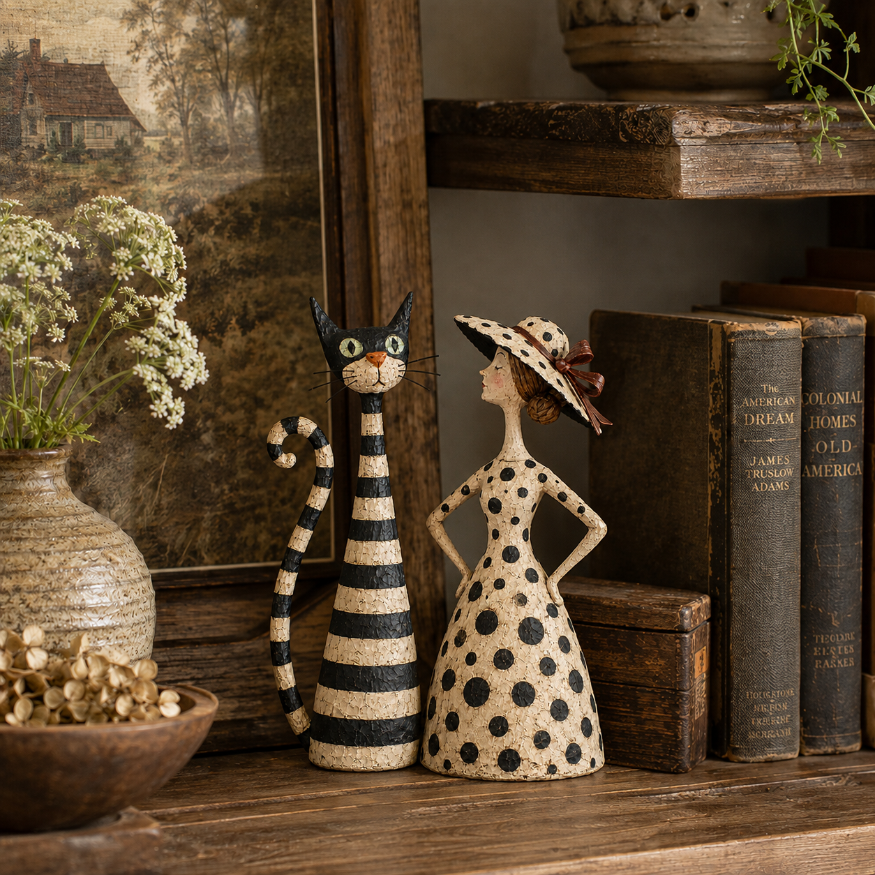 Cat and lady sculpture duo styled in a vintage home