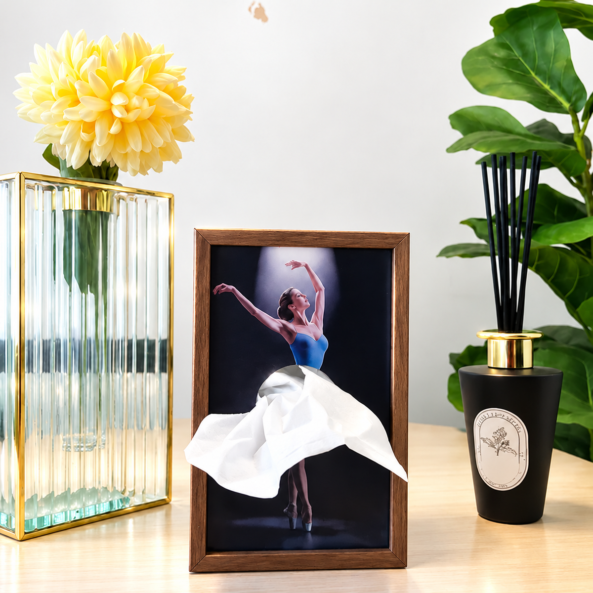 Wood-tone ballerina tissue holder beside flowers and fragrance