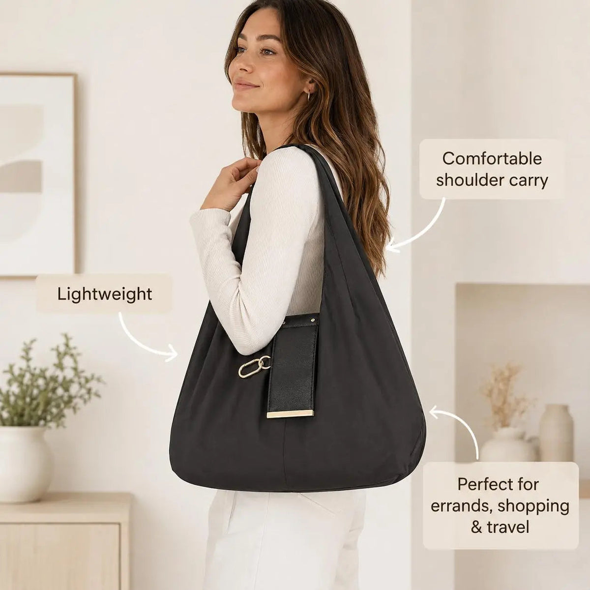 Woman carrying black foldable keychain tote bag